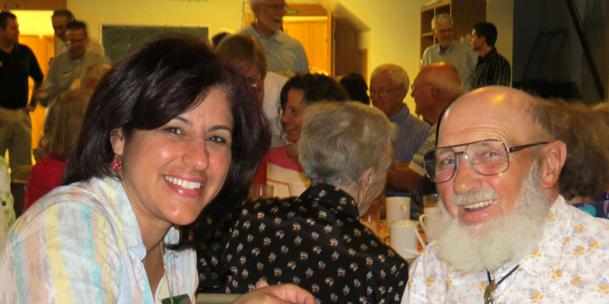 Madeline Maldonado and Herman Miller converse during the June 7 Africa Festival hosted by Mennonite Mission Network at Shalom Mennonite Church in Newton