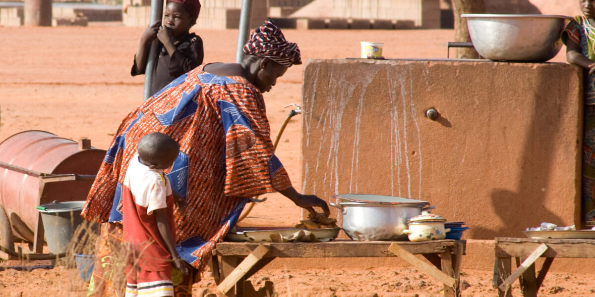 A woman in Burkina Faso prepares food.