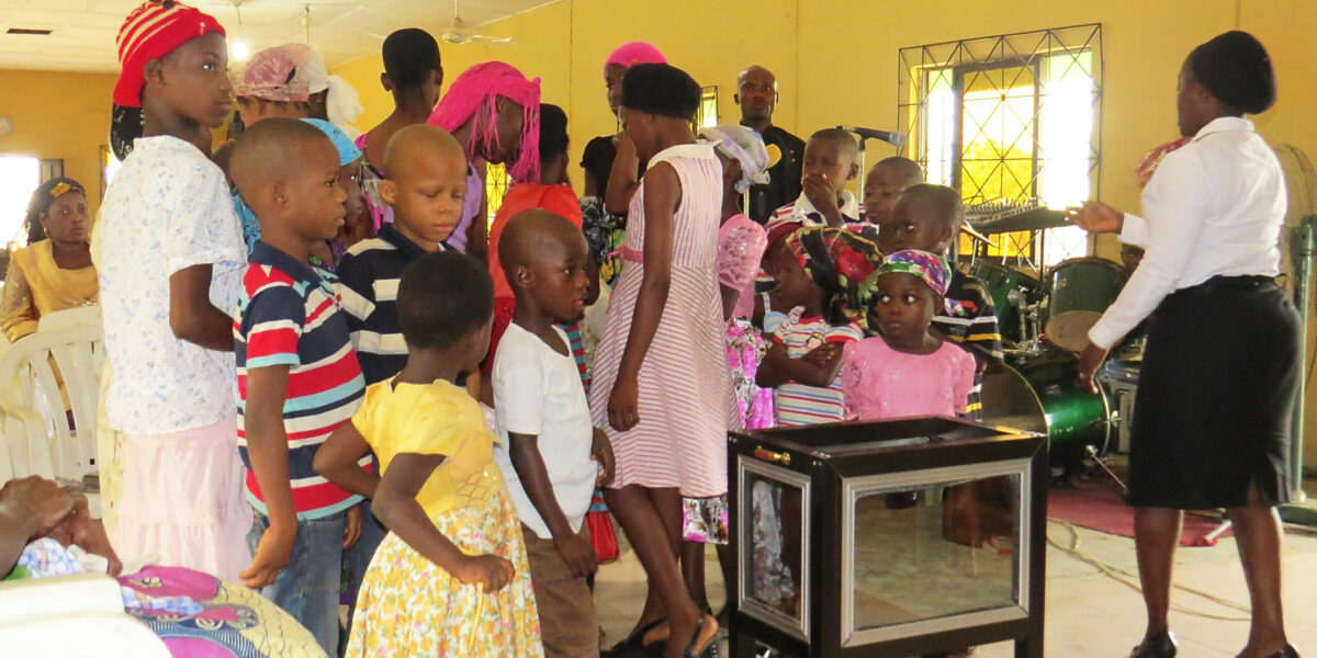 Children from the Mennonite Church Nigeria congregation in Uyo form a processional to give their offerings. Photographer: Lynda Hollinger-Janzen  Download full-resolution image.