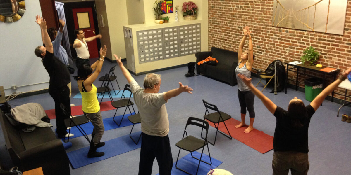 DISH tenants exercise and relax together during an eight-week yoga class organized by Alyssa Schrag. Photo by Alyssa Schrag. Download full resolution image.