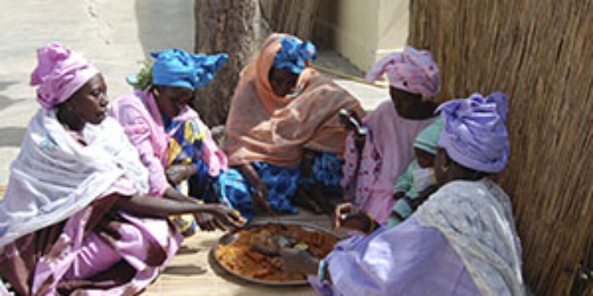 Wolof followers of Jesus share a meal during the women's day seminar in St. Louis