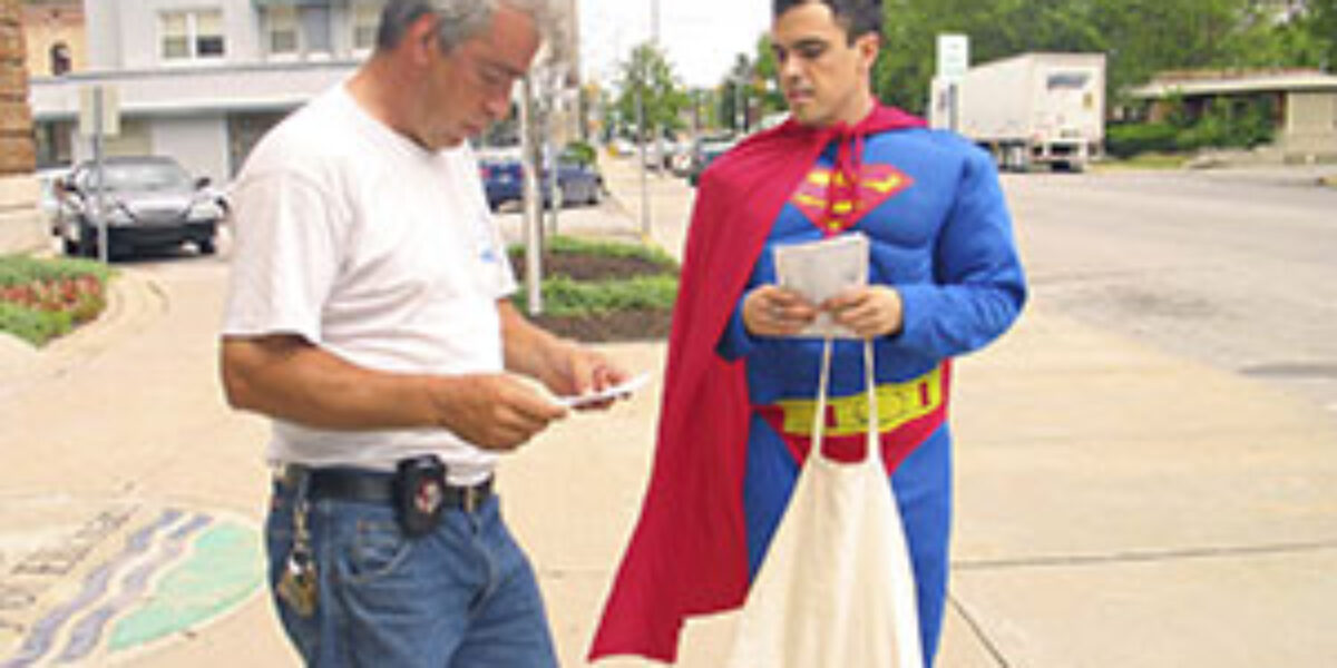 Mark McCain (left) talks to Nicholas Cloutier about an upcoming event
