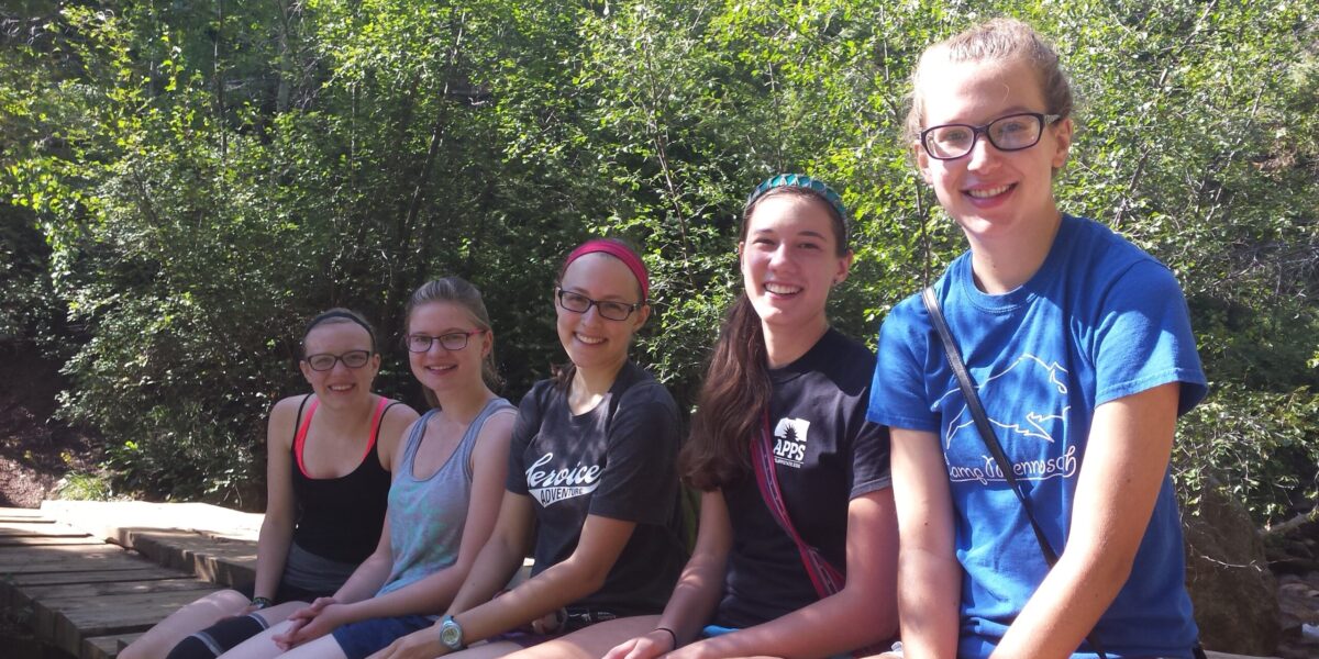 Members of the Colorado Springs Service Adventure unit take a break during a hike.  Left to right:  Franzi Klause