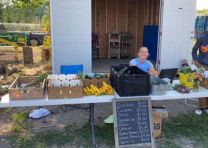 ​MVSer Elizabeth Breckbill volunteers at the food stand as part of her job with the Rio Grande Farm Park in Alamosa