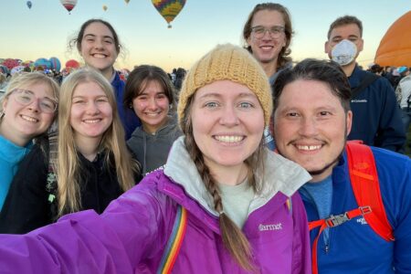 Back row: Malia Bauman, Micah Wenger, and August Barrett-Fox middle row: Neeltje Sandersfeld, Ronja Loritz, and Rylee Weishaupt front row: Shelby and Travis Clarke Colorado Springs and Albuquerque Service Adventure @balloonfiesta 2022