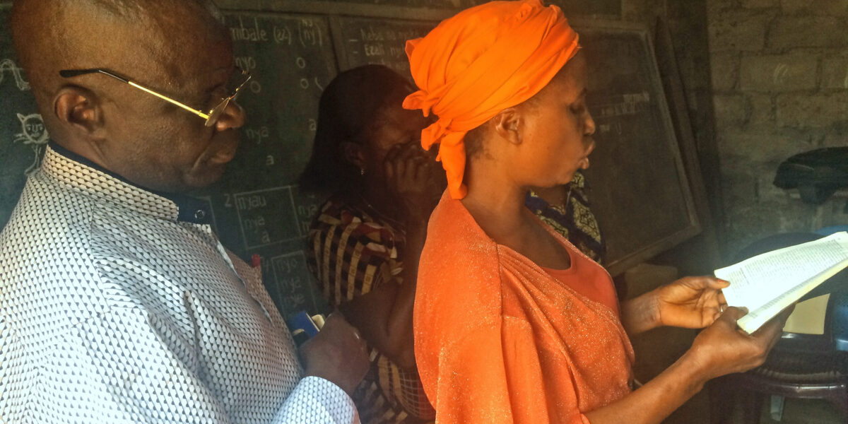 Claudine Lutondo of Kinshasa reads the Bible in Lingala. Photo provided by AIMM.