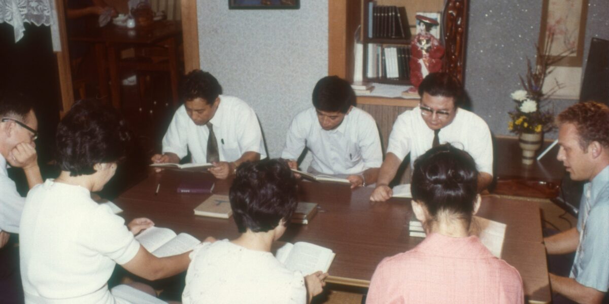 On right, Carl Liechty in an English language Bible study in December 1973 Kagashima, Japan. Photo courtesy of Mennonite Church USA.