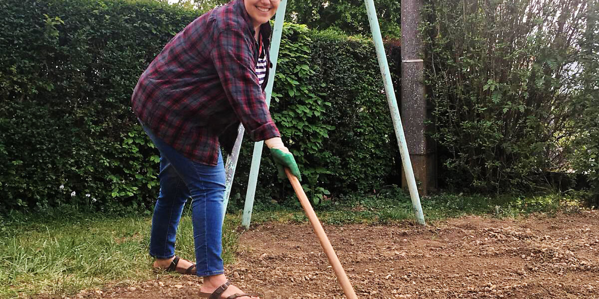 Kate Widmer works in her “confinement” garden in Béthoncourt