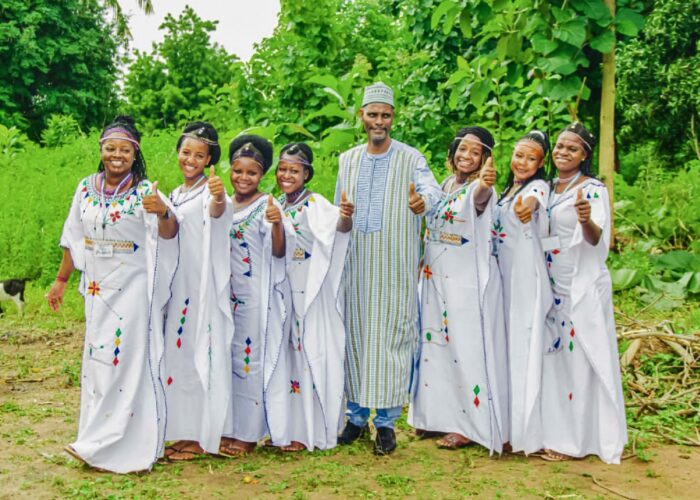 Daniel Dama (center) poses with members of a music ensemble during a festival in Djougou, Benin, in August 2025. Photographer: Bill Harris