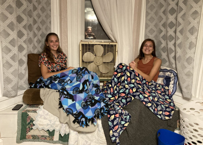 Roommates Luisa Dutchersmith and Lexie Coburn  in their cozy place — the bay window in their bedroom. Photo by Julia Yoder.