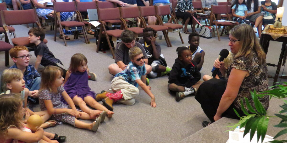 Sandy Miller of Mennonite Mission Network's Work in Progress Ensemble tells the children of Paoli Mennonite Fellowship a story on Sept. 24
