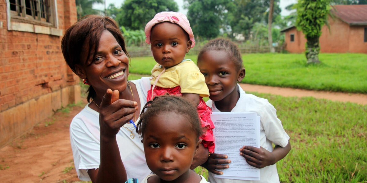 ​Tshiela Kalonji takes a break from her studies at Kalonda Bible Institute with three of her five children. Photo by Charles Buller.