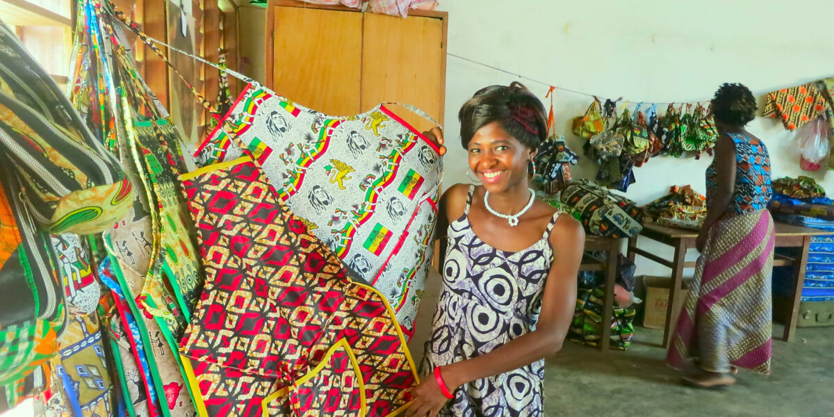 ​Marina Loua grew up at La Casa Grande children's home in Benin where she learned to be a seamstress. She now teaches sewing and helps mentor youth at Jeunes Espoir d'Afrique in Ivory Coast. Photo by Steve Wiebe-Johnson.