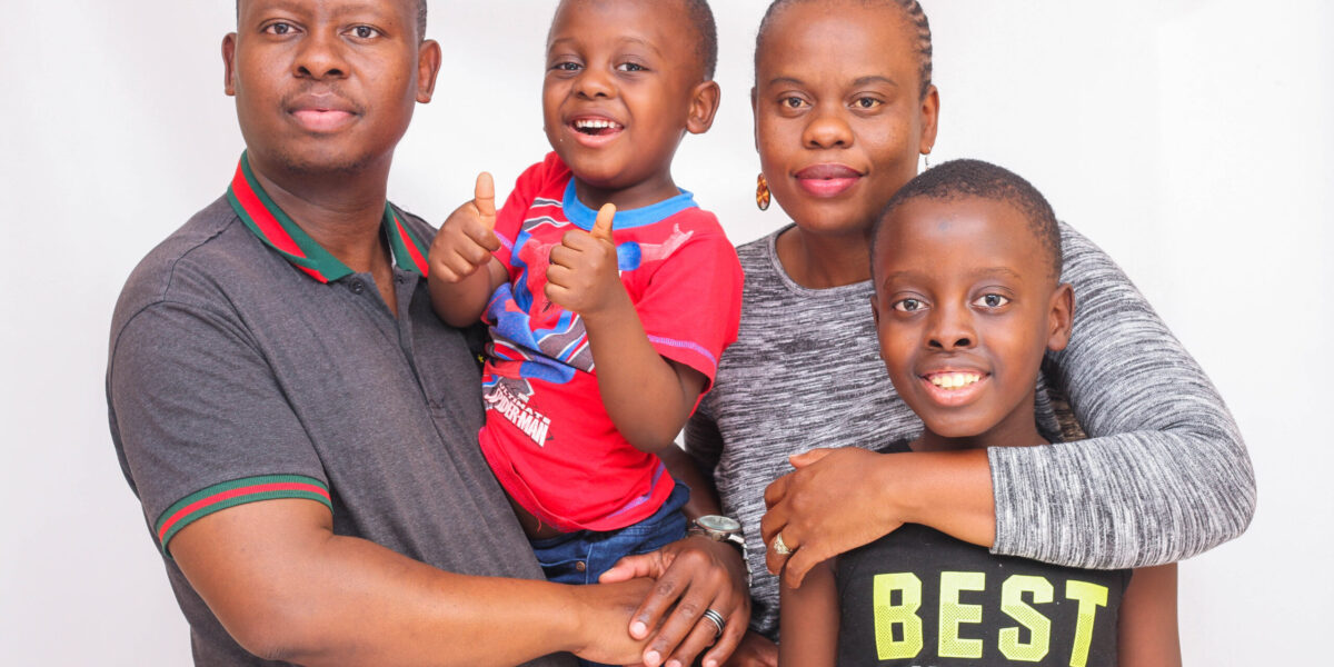 ​Lyenor Lionel Nkosi and his family. (Further information withheld for security reasons.) Photographer: Lucky Nkhurutshi. 