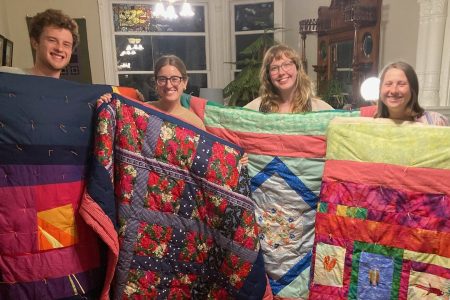Each year, the San Francisco MVS unit is invited to gather together and craft comforters for themselves. Karen Kreider Yoder, a member of the unit's host congregation, First Mennonite Church of San Francisco, hosts the group at her home for this annual tradition. At the end, each participant takes home their own cozy comforter to use during their service term and beyond! Left to right: Keyan Krabill, Bella Kephart, Emmi Scott and Ana Neufeld Weaver. Photo by Karen Kreider Yoder.