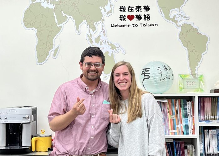 Caleb and Stephanie Schrock-Hurst pose with "finger hearts" (a popular Taiwanese photo gesture, like the peace sign) in the National Dong Hwa University Chinese Language Center office.