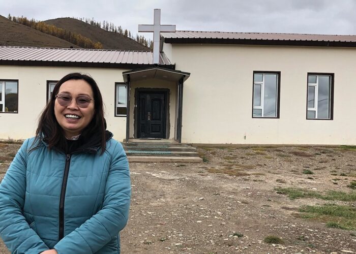 Pastor Oogii in front of the Terelj Christian Church. — Sister Care