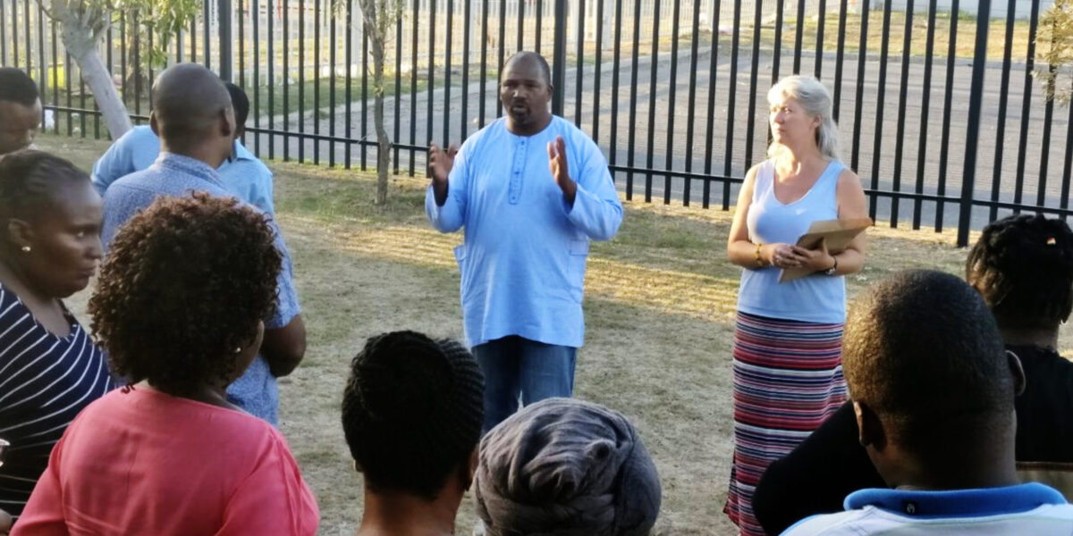 ​Oscar Siwali addresses Lwandle Leaders Community Conflict Transformation workshop participants with Kathryn Smith Derksen. Photo provided.