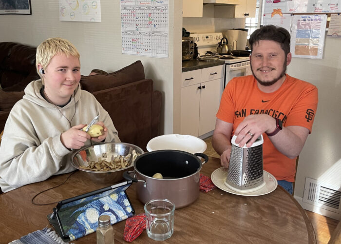 ​Nelly Sandersfeld and Travis Clarke (leader) making dinner at the Colorado Springs (Colorado) Service Adventure unit house. Photo by Shelby Clarke.