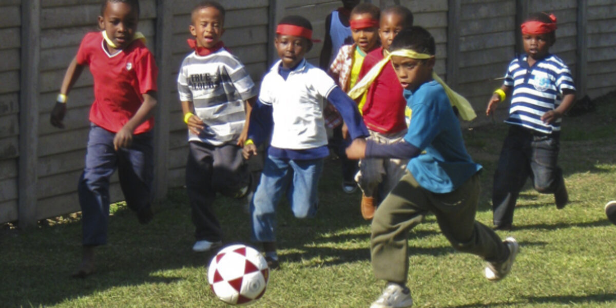 Brayden leads his team’s attack on goal during Holiday Club’s World Cup tournament at Breakthru Church. (Photo by Anna Yoder)Download high-resolution photo.