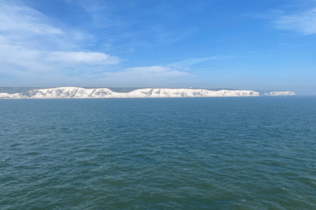 The famous white cliffs of Dover, as seen by the pilgrimage team from the ferry they rode from Calais to the United Kingdom. Photo by Shelby Rudy.