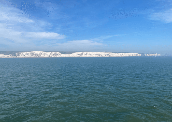 The famous white cliffs of Dover, as seen by the pilgrimage team from the ferry they rode from Calais to the United Kingdom. Photo by Shelby Rudy.